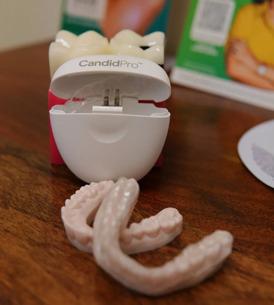 CandidPro clear aligner trays with their carrying case