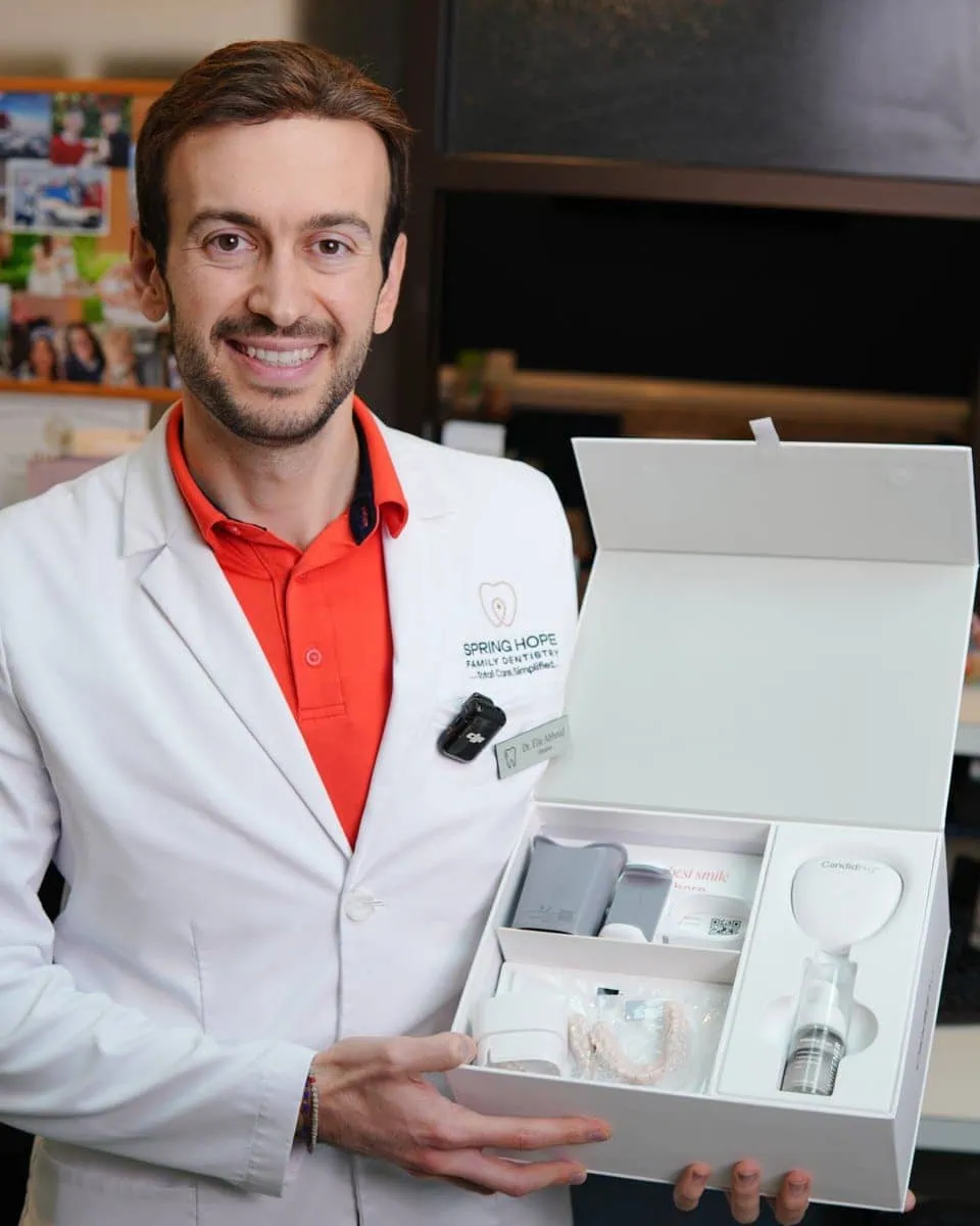 Dr. Abboud holding the CandidPro ScanBox at-home monitoring kit