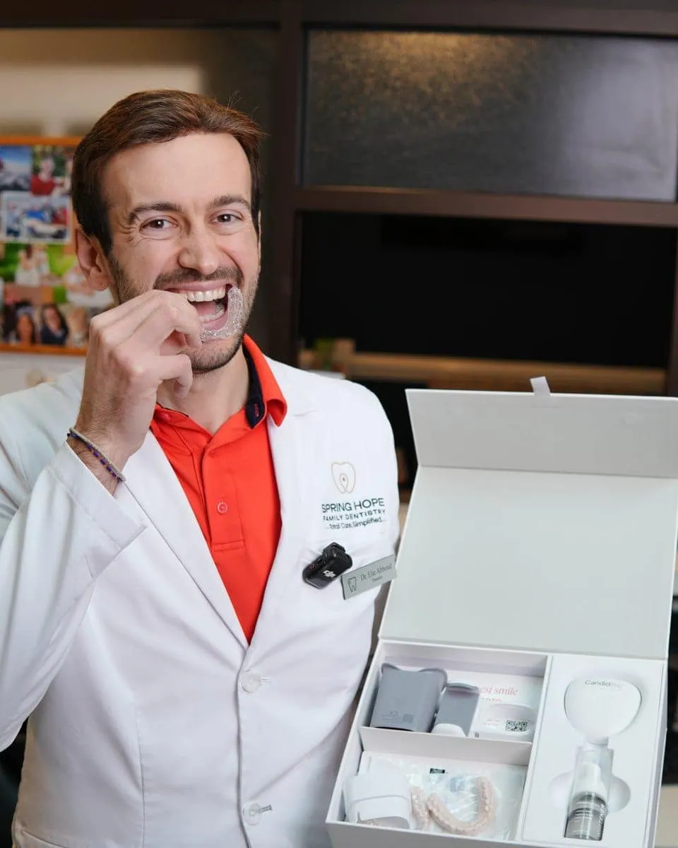 Dentist trying in a clear aligner tray
