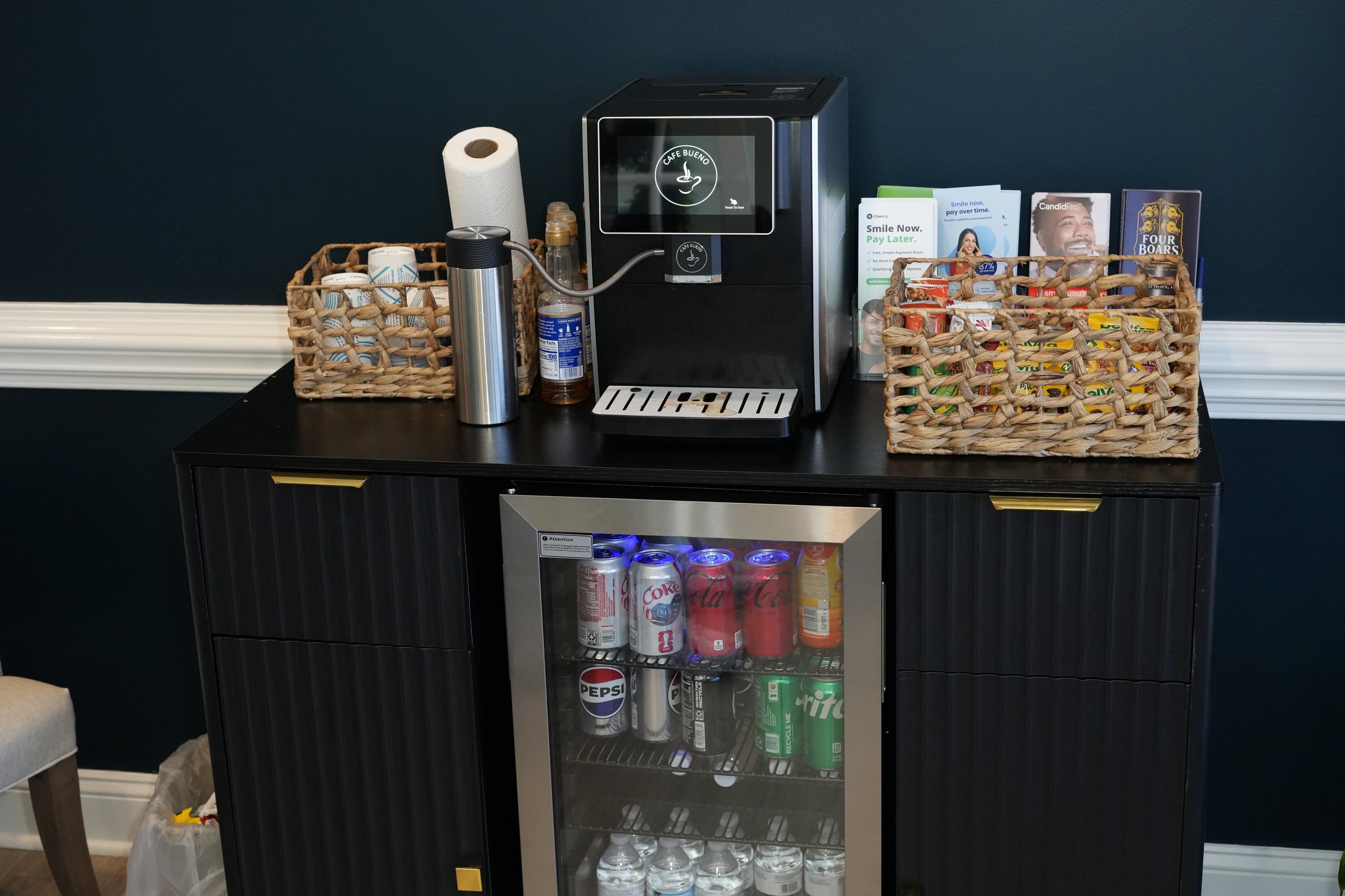 Complimentary coffee and refreshment station in the waiting area