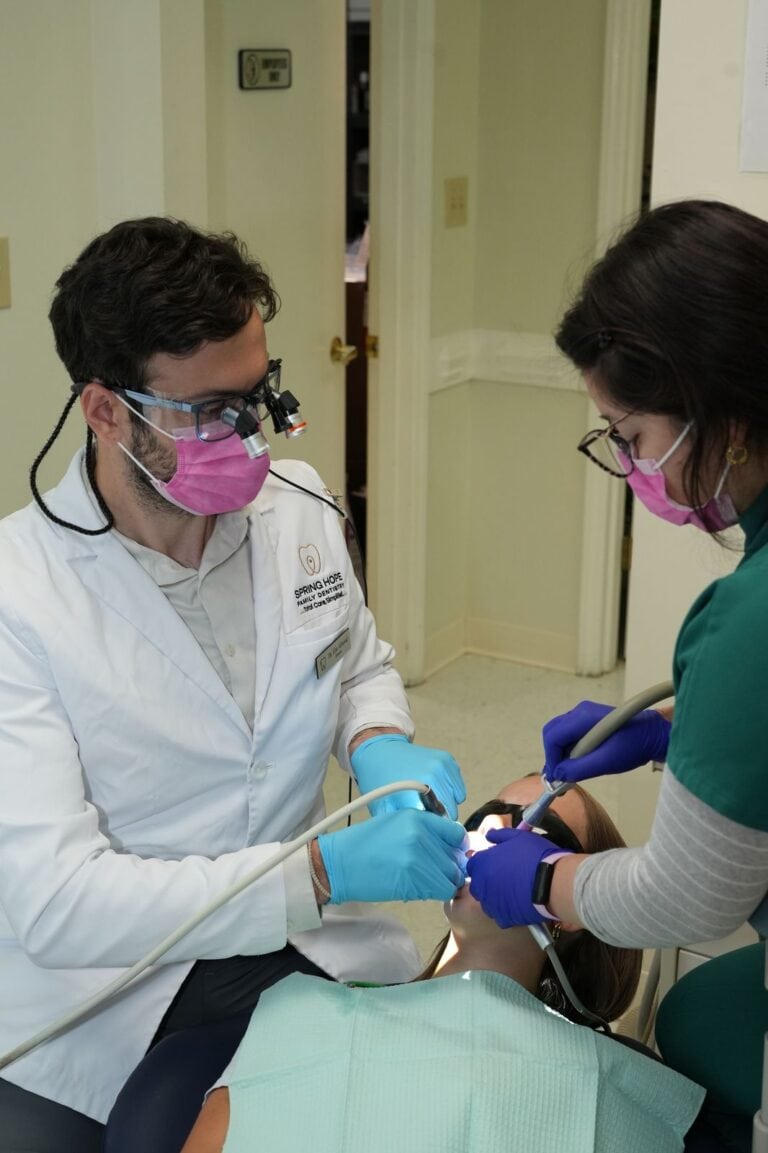 Dr. Abboud providing gentle chairside dental care
