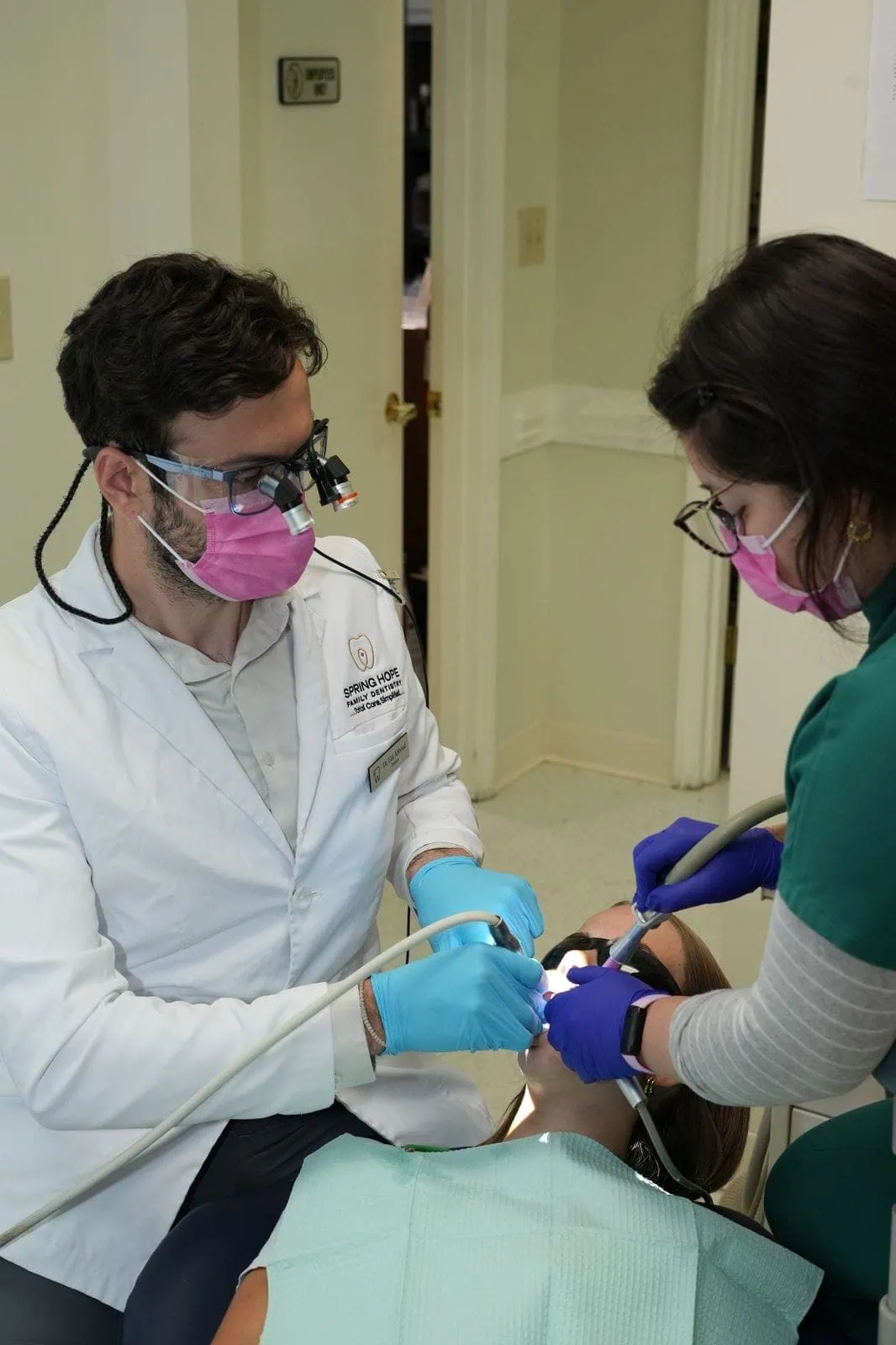 Dr. Abboud providing gentle chairside dental care