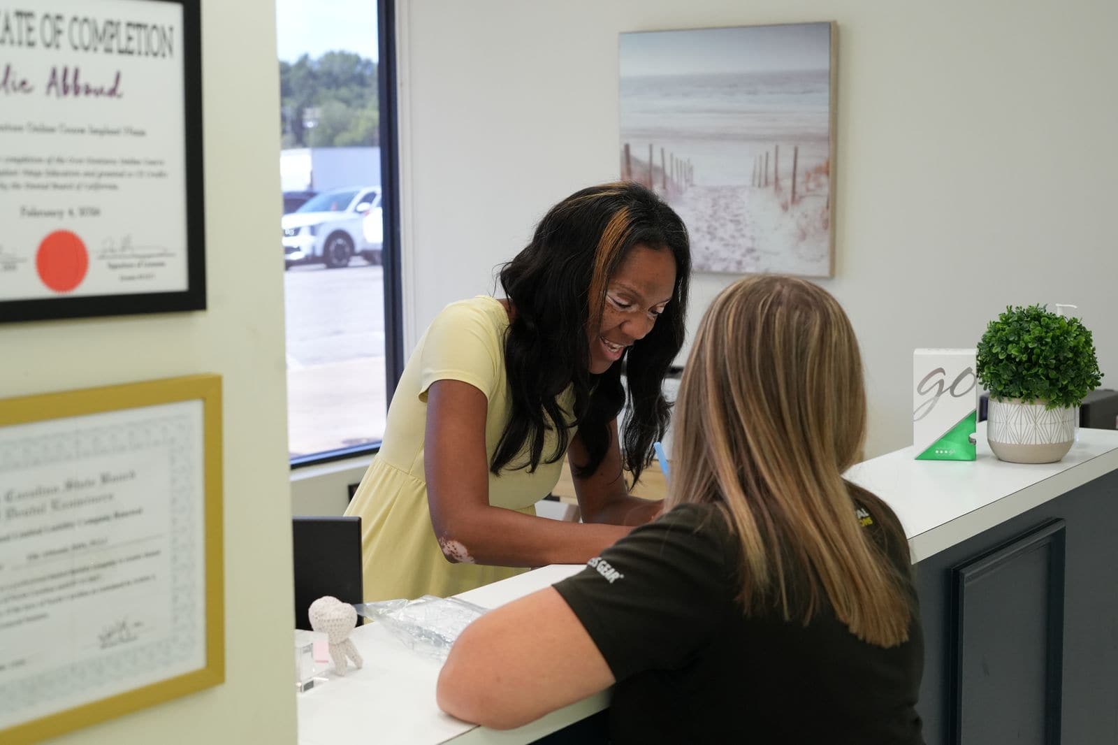 Front desk team member welcoming a patient at Spring Hope Family Dentistry