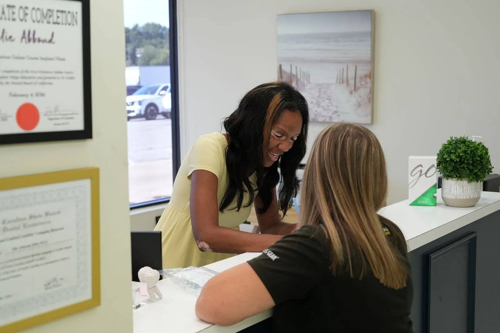 Front desk team member welcoming a patient at Spring Hope Family Dentistry