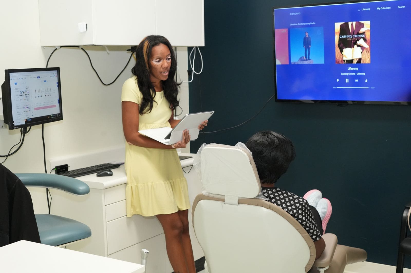 Team member reviewing treatment details with a patient in the operatory