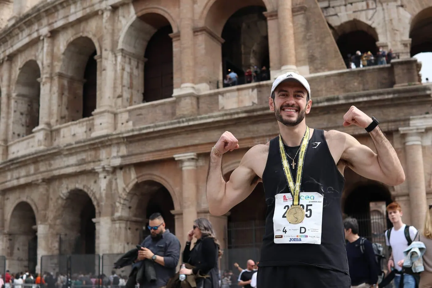 Dr. Elie Abboud celebrating at the Colosseum after running the Rome Marathon