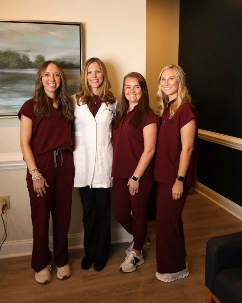 Dr. Hilary Patterson with three clinical team members at Spring Hope Family Dentistry
