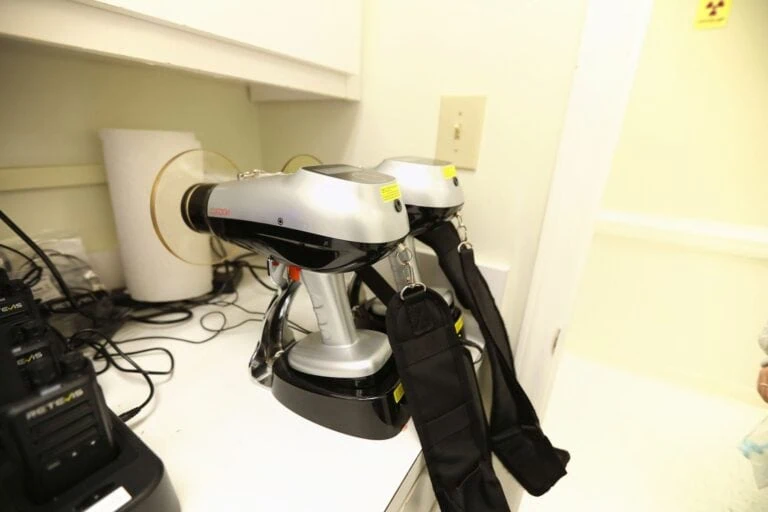 Handheld 3D scanners in their charging stand