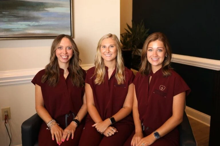 Clinical team members in maroon scrubs at Spring Hope Family Dentistry