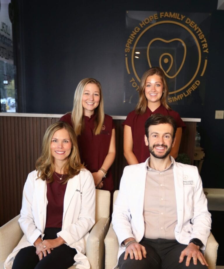 Dr. Elie Abboud and Dr. Hilary Patterson with two team members in the Spring Hope Family Dentistry lobby