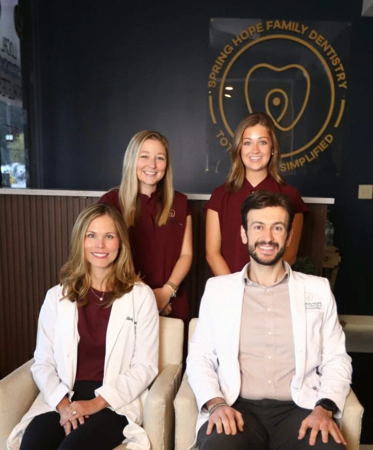 Dr. Elie Abboud and Dr. Hilary Patterson with two team members in the Spring Hope Family Dentistry lobby