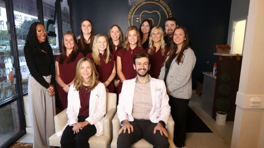 The Spring Hope Family Dentistry team in the office lobby in Spring Hope, NC